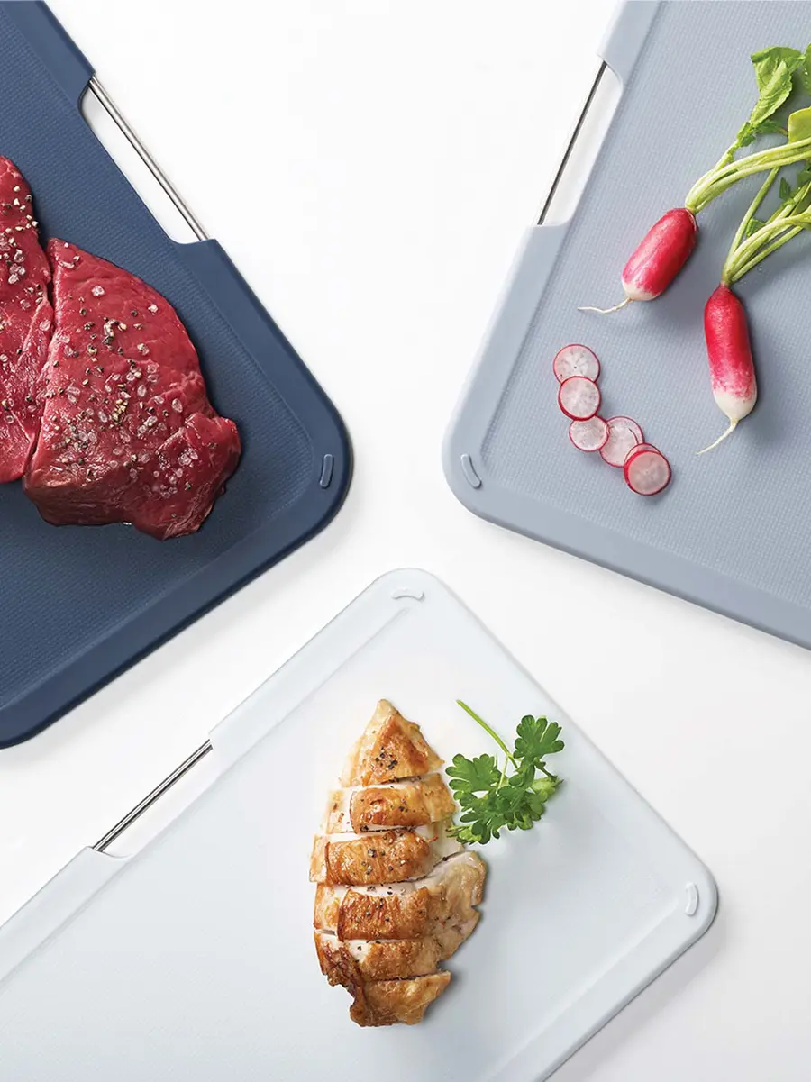 Joseph Joseph Nest™ color-coded chopping board set in vertical storage stand