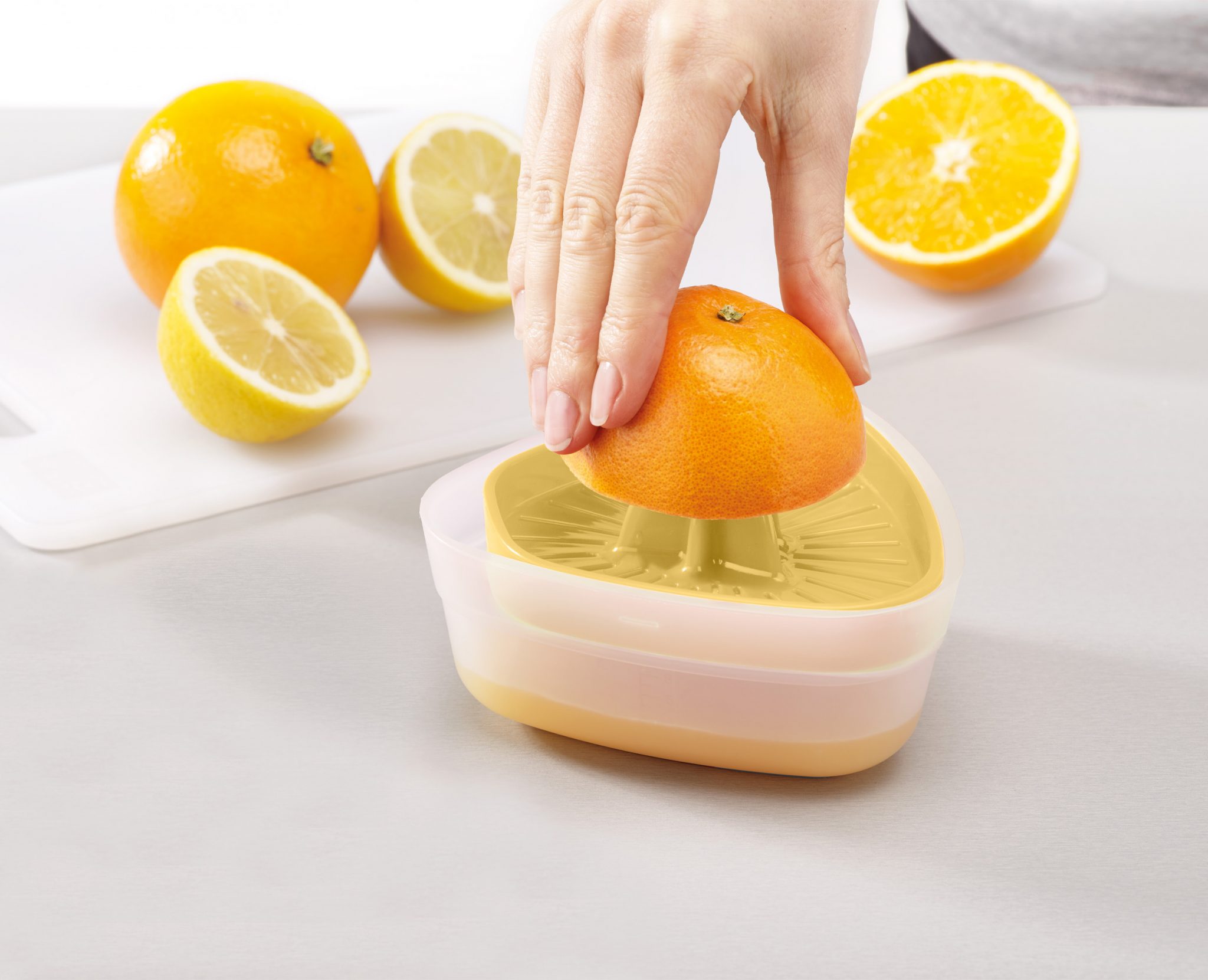 compact citrus juicer Powerful citrus juicer with BPA‑free reversible lid and non-slip base by Joseph Joseph